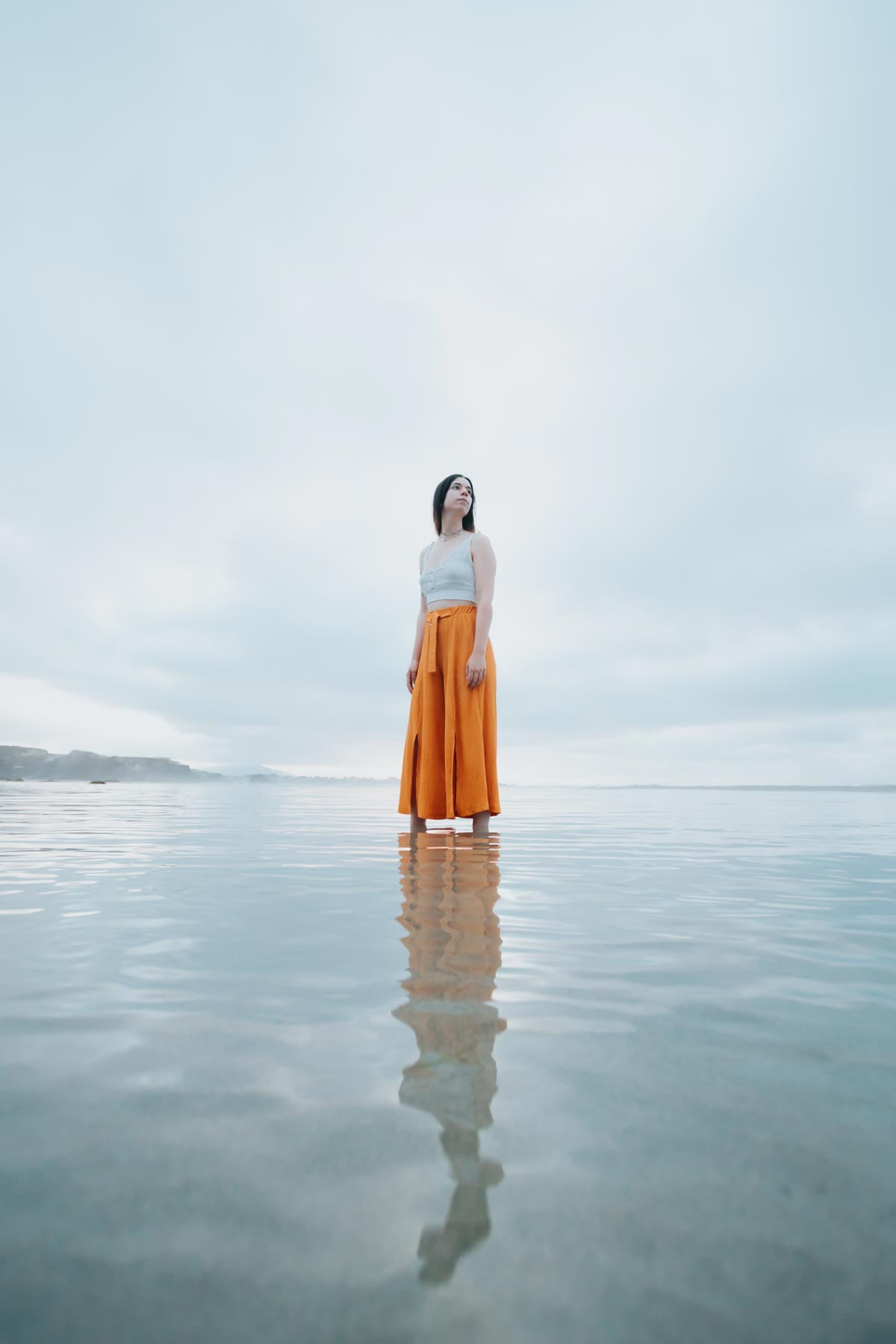A person standing in still water