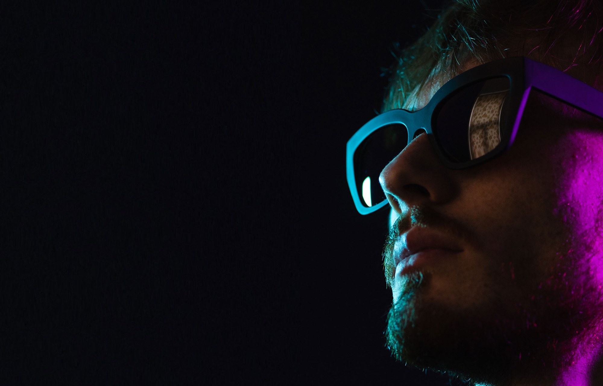 Portrait in cyan and magenta light