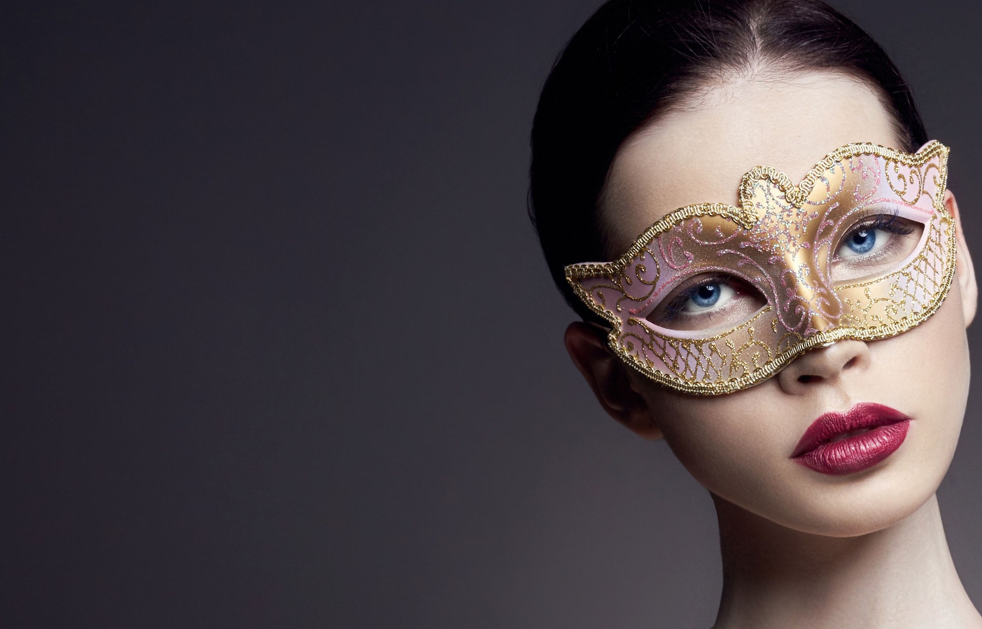 Portrait wearing an ornate eye mask