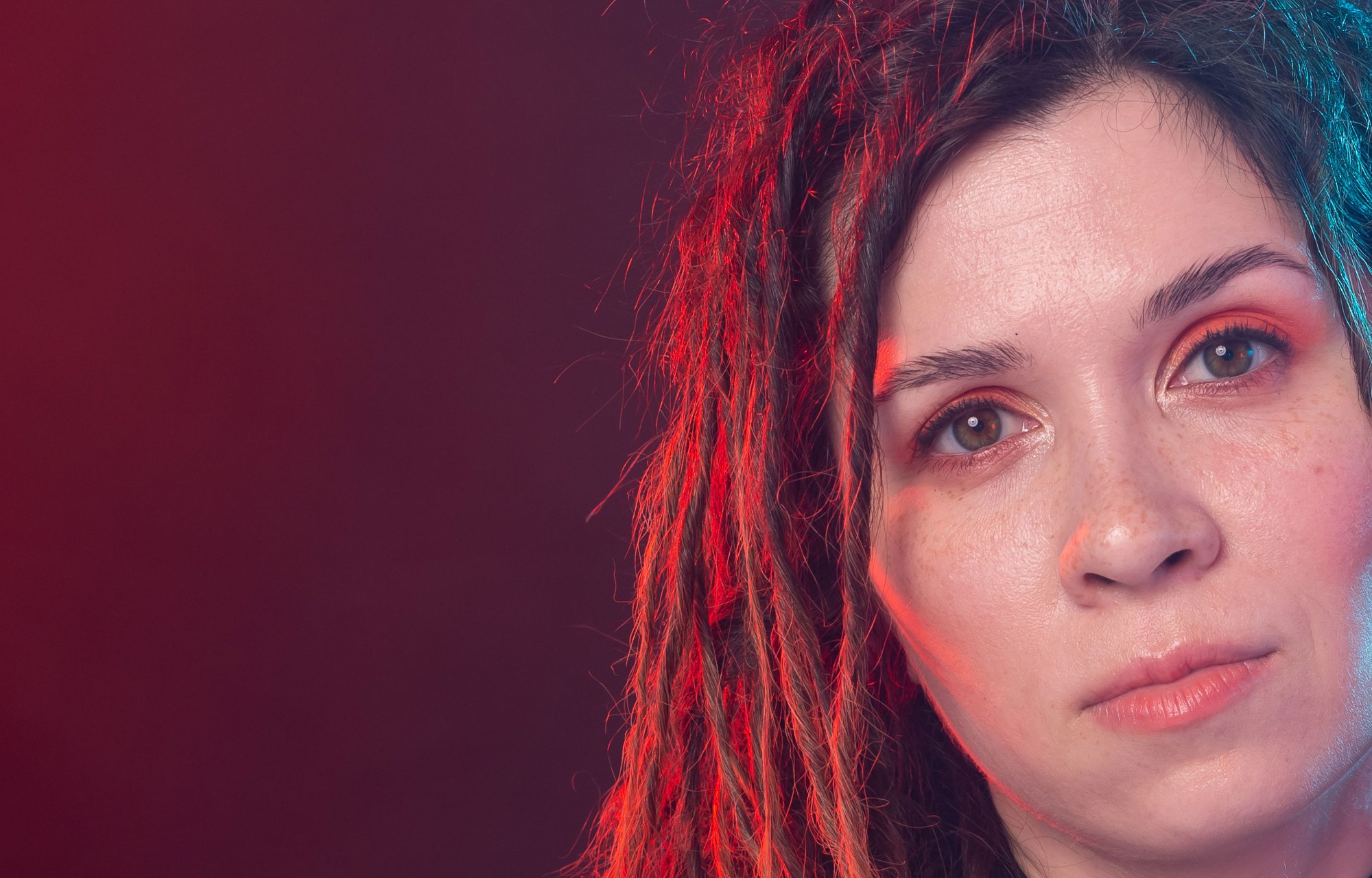 Close portrait with coloured edge lighting